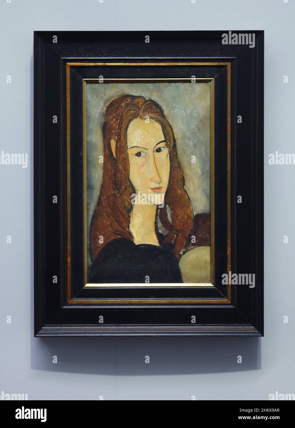 Painting 'Girl with Red Hair' ('Jeanne Hébuterne') by Italian modernist painter Amedeo Modigliani (1918) on display at his retrospective exhibition in the Albertina Museum in Vienna, Austria. The exhibition marking the centenary of artist's death runs till 9 January 2022. Stock Photo