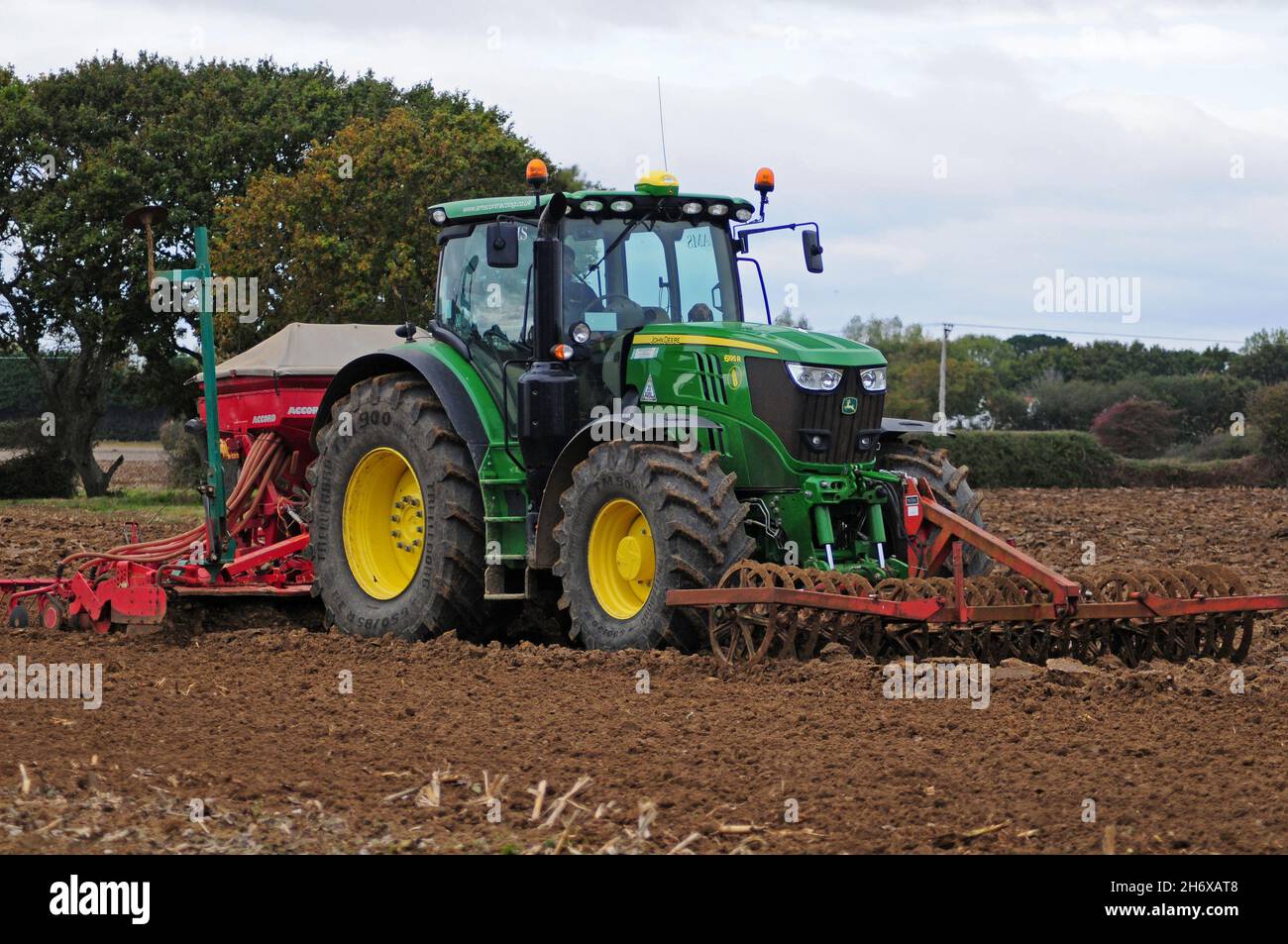 Harrowing and drilling, on the Coastal Plain, West Sussex. Stock Photo