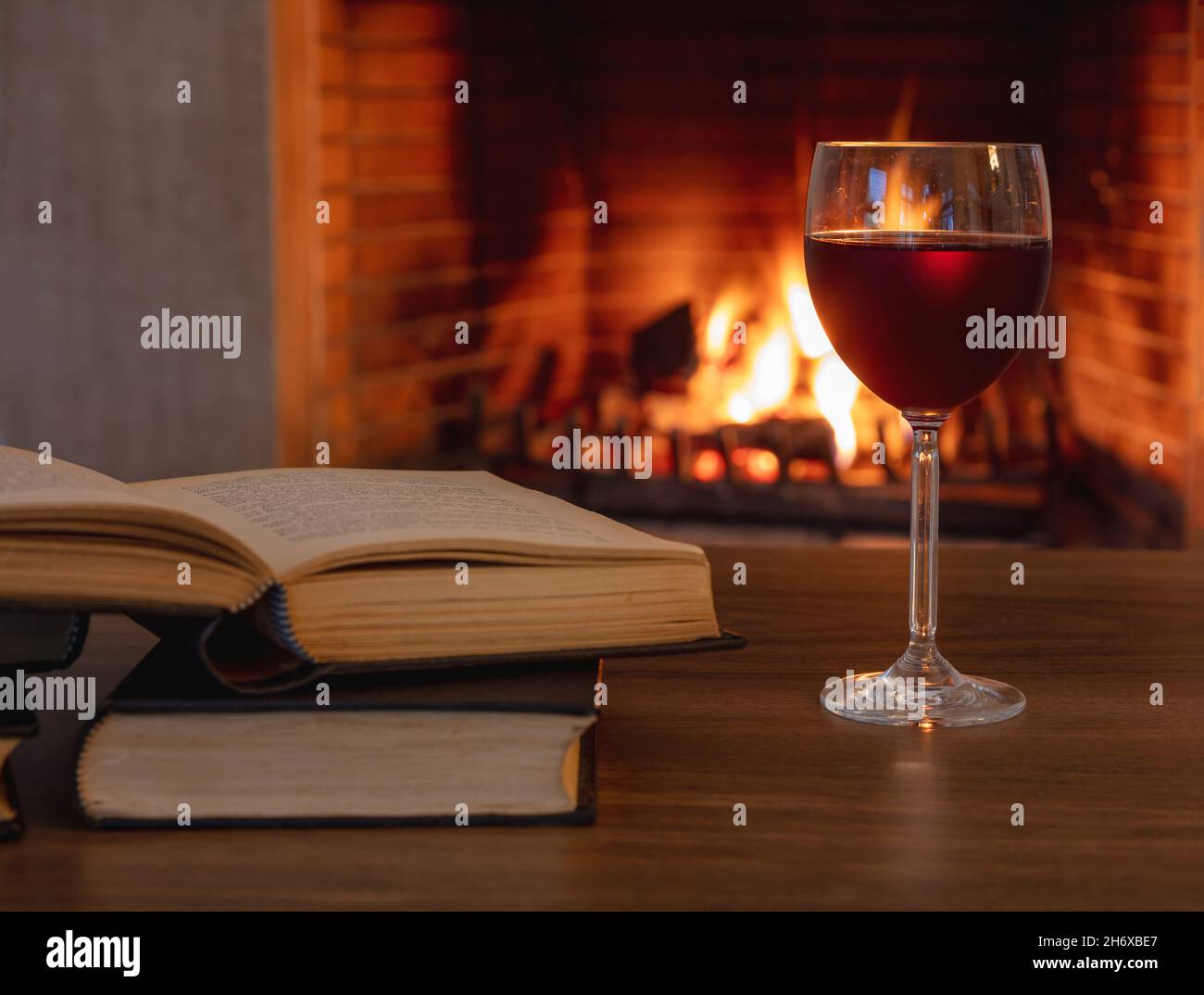 Fire fireplace reading cozy wine hi-res stock photography and images - Alamy