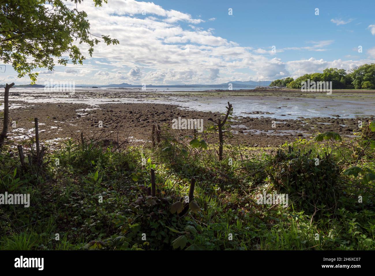 View from the Fife Coastal Path at Dalgety Bay over the Firth of Forth to the Lothian Coast beyond. Stock Photo