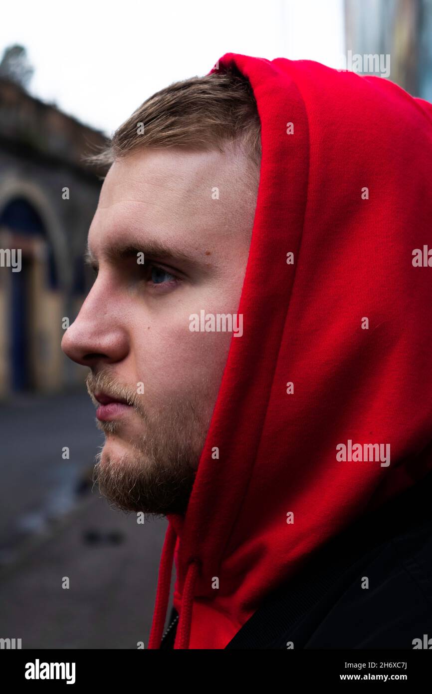Man in red hoodie, Glasgow Stock Photo