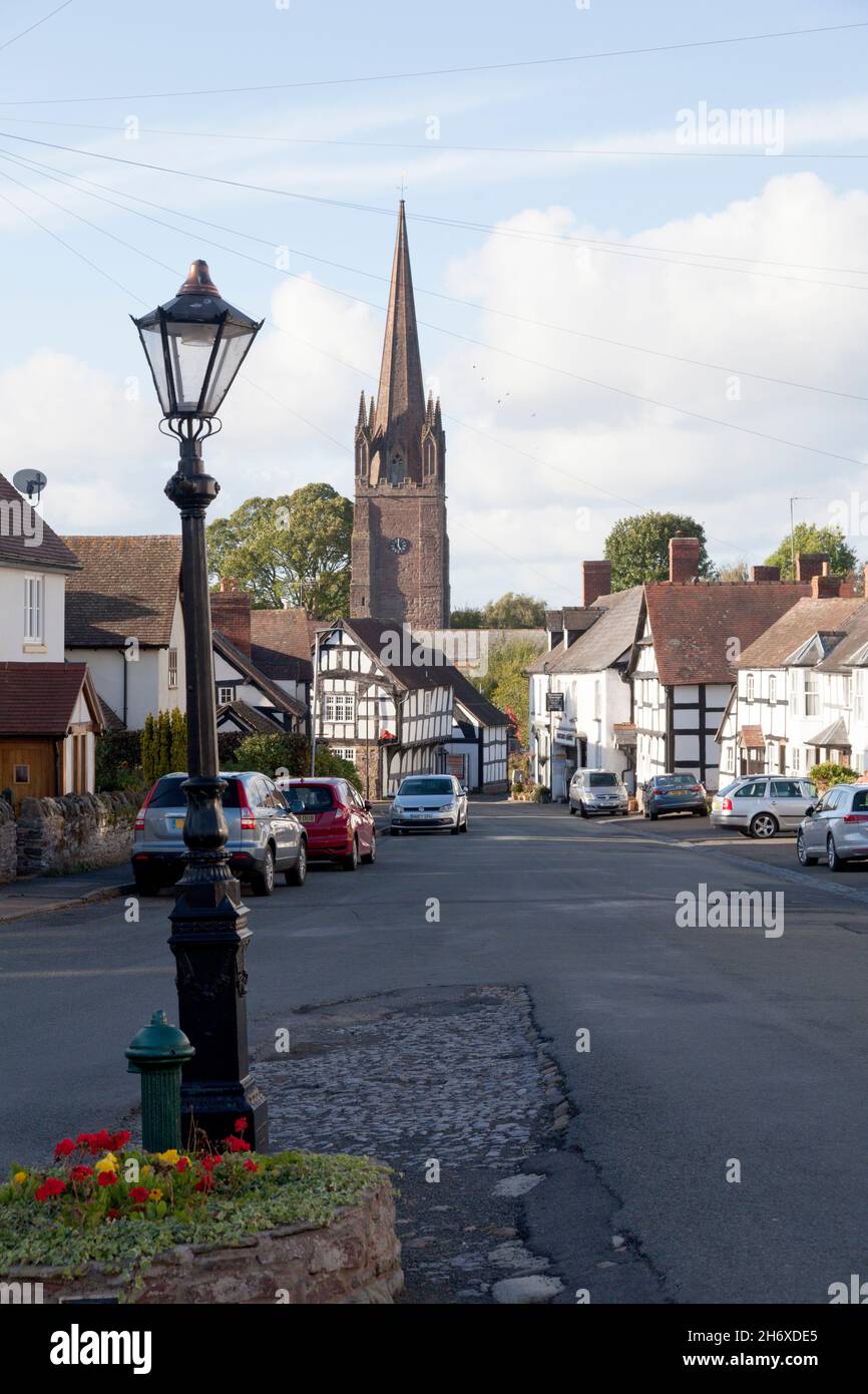 View along Broad Street towards Church of St Peter and St Paul, Weobley, Herefordshire Stock Photo