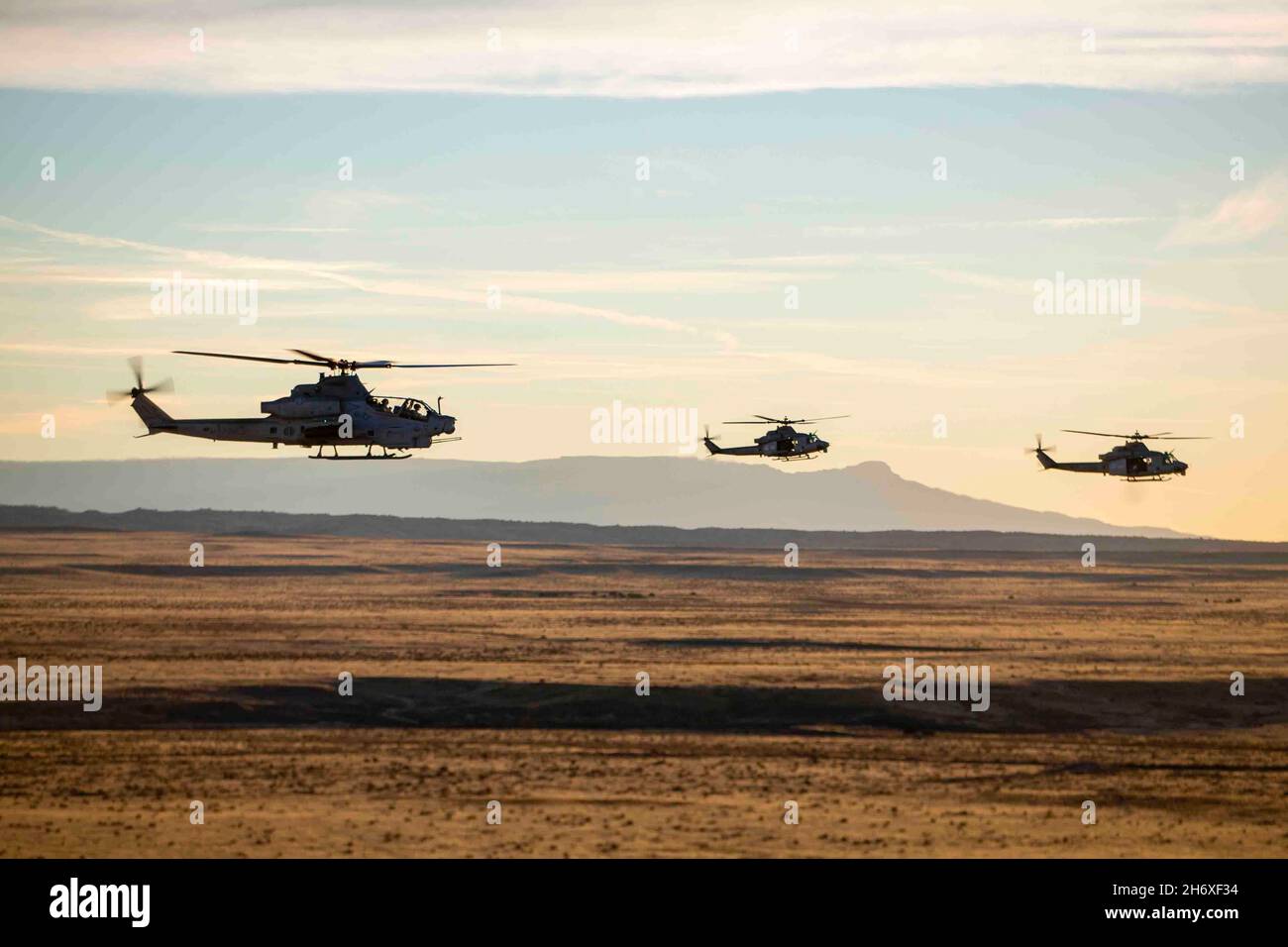 Lamar, Colorado, USA. 12th Nov, 2021. An AH-1Z Viper helicopter and two UH-1Y Venom helicopters assigned to Marine Light Attack Helicopter Squadron (HMLA) 269 fly over Lamar, Colorado, Nov. 12, 2021. Marines with HMLA-269 trained in a cold-weather, high-altitude environment to increase proficiency in expeditionary advanced basing operations (EABO). HMLA-269 is a subordinate unit of 2nd Marine Aircraft Wing, the aviation combat element of II Marine Expeditionary Force. Credit: U.S. Marines/ZUMA Press Wire Service/ZUMAPRESS.com/Alamy Live News Stock Photo