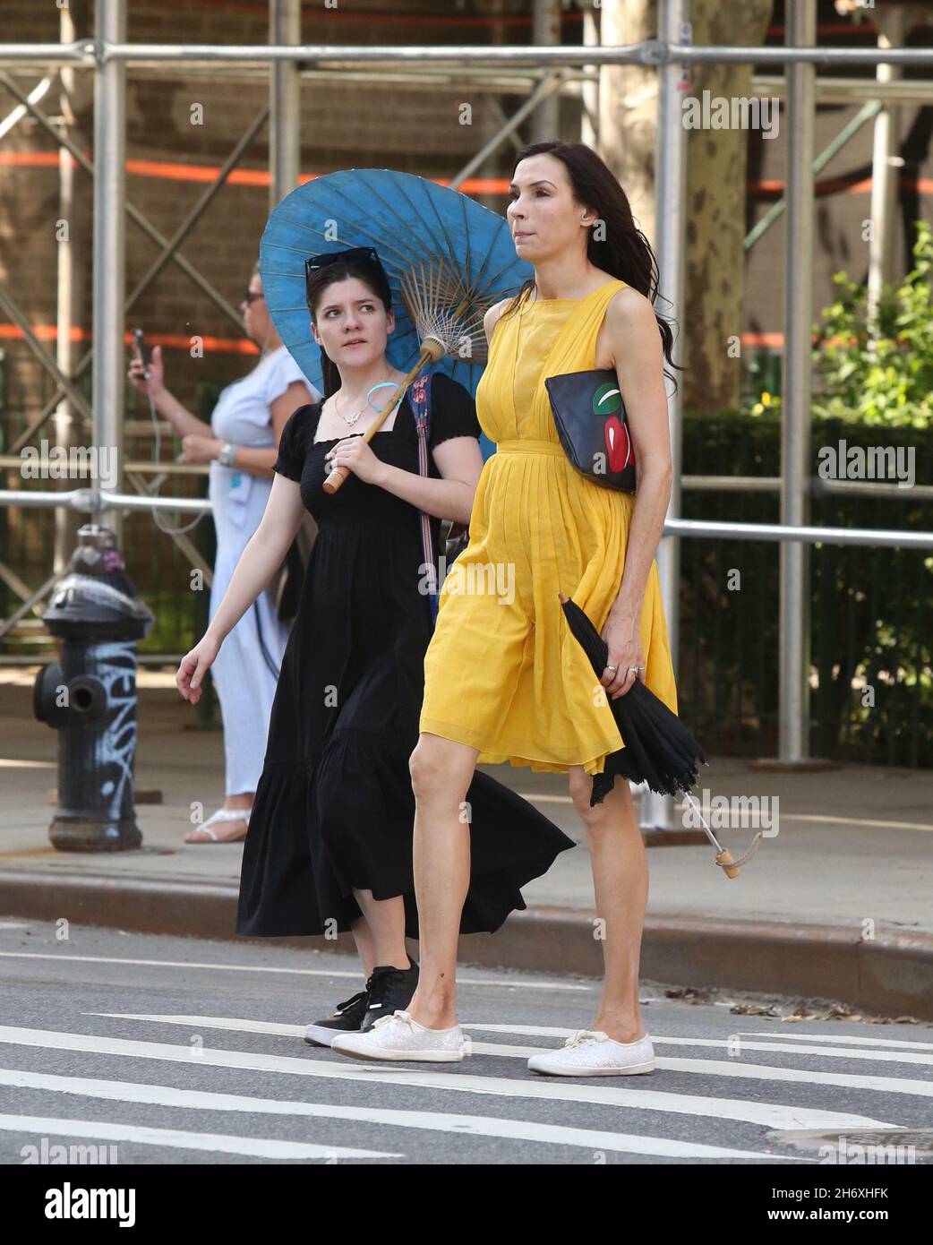 New York - NY - 05/27/2019 - Famke Janssen and Madeleine Martin walking  around the East Village on Memorial Day with umbrellas to shield the hot  sun -PICTURED: Famke JanssenMadeleine Martin Stock Photo - Alamy