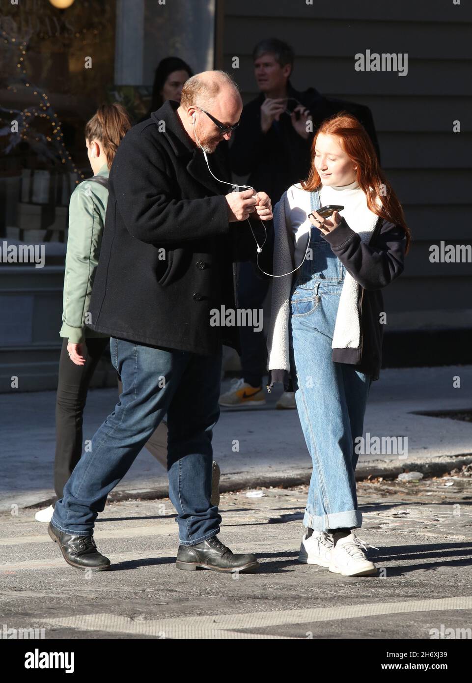 New York - NY - 12/23/2019- Louis C.K. and daughter Mary Louise Szekely (14  years old) joking around with each other and sharing headphones in Soho  -PICTURED: Louis C.K.Mary Louise Szekely Stock Photo - Alamy