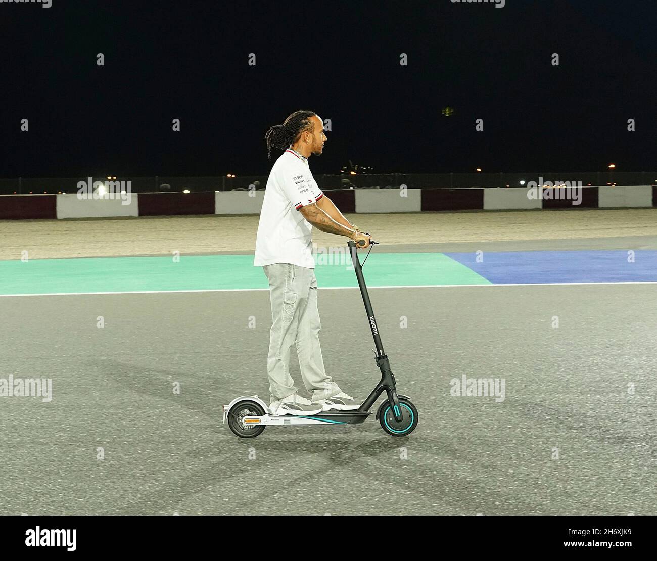 November 18, 2021, Losail International Circuit, Doha, Formula 1 Ooredoo  Qatar Grand Prix 2021, in the picture Lewis Hamilton (GBR), Mercedes-AMG  Petronas Formula One Team laps the course with an electric scooter
