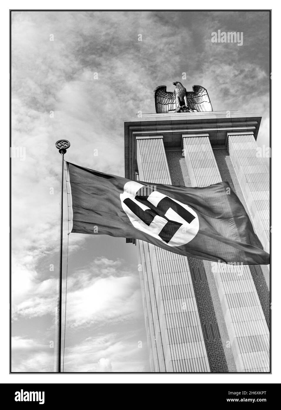 GERMANY 1937 World Exhibition Paris 1937 The German Pavilion with German eagle and Swastika Flag flying at the Paris World Exhibition France The Exposition Internationale des Arts et Techniques dans la Vie Moderne (International Exposition of Art and Technology in Modern Life) was held from 25 May to 25 November 1937 in Paris, France Albert Speer's pavilion was culminated by a tall tower crowned with the symbols of the Nazi state: an eagle and the swastika. The pavilion was conceived as a monument to 'German pride and achievement'. Stock Photo