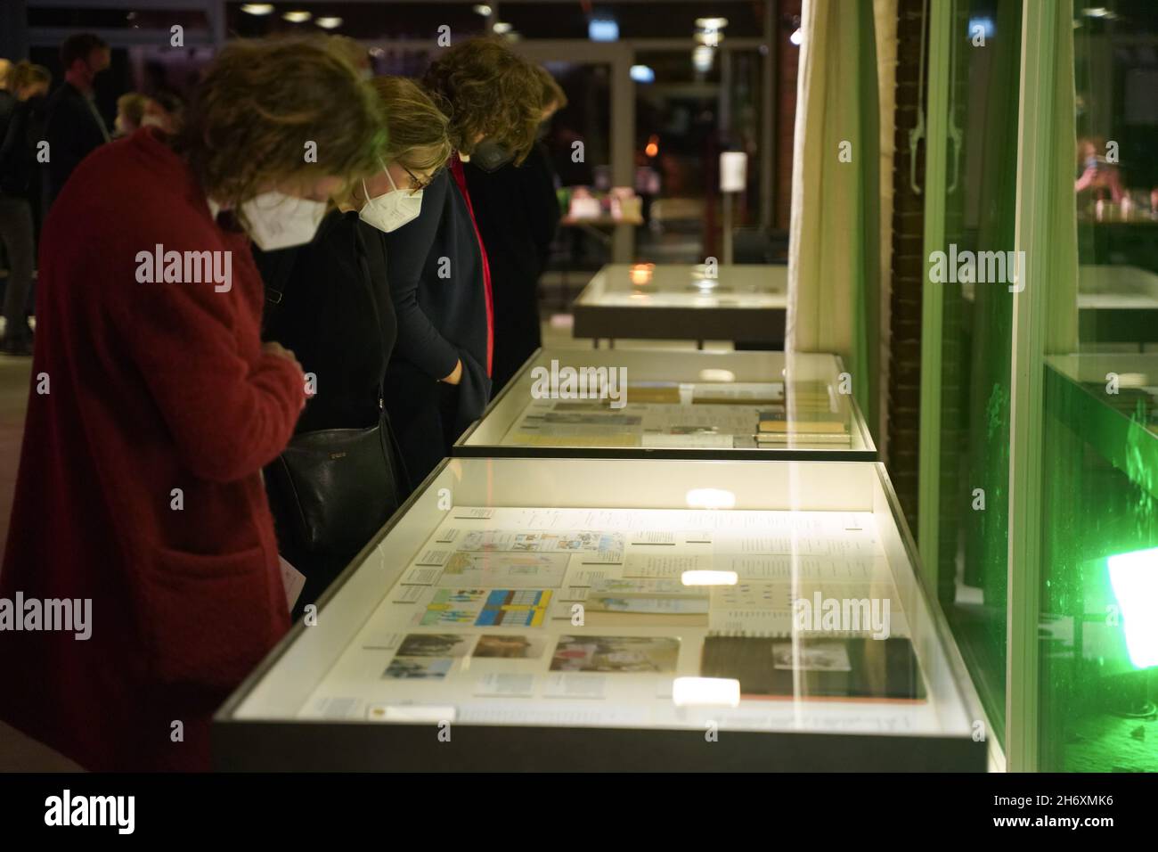 Berlin, Germany. 18th Nov, 2021. Visitors look at the display cases of the Roger Willemsen Archive 'Ein Mensch - Ein Ereignis - Ein Glück. Roger Willemsen' at the Akademie der Künste. The showcase exhibition presents for the first time unknown documents from Willemsen's estate, including manuscripts, notebooks and photographs. Credit: Jörg Carstensen/dpa/Alamy Live News Stock Photo