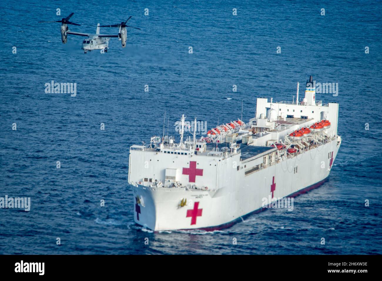 Pacific Ocean. 10th Nov, 2021. An MV-22B Osprey assigned to Marine Medium Tiltrotor Squadron (VMM) 164, based at Marine Corps Air Station (MCAS) Camp Pendleton, Calif., conducts flight operations aboard the Military Sealift Command (MSC) hospital ship USNS Mercy (T-AH 19) during Mercy Exercise (MERCEX) 22-1, Nov. 10, 2021. MERCEX 22-1 is a three-week-long pierside and underway training evolution that highlights integration, training and camaraderie between MSC civilian mariners and MTF Sailors. USNS Mercy (T-AH 19) can steam to assist anywhere to provide relief as a symbol of Navy Medicin Stock Photo