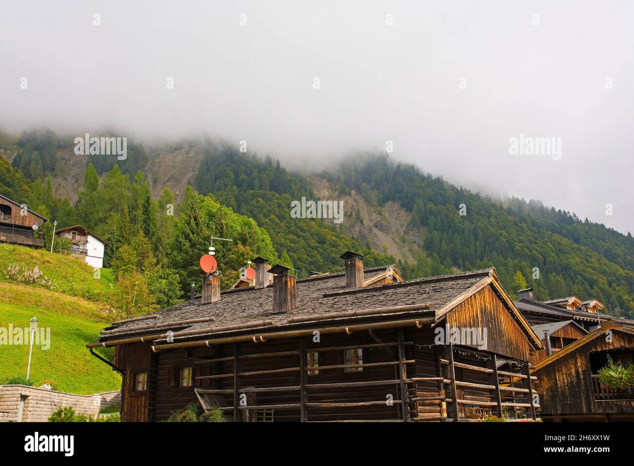 Traditional wooden buildings in the Alpine village of Sauris di Sopra, Udine Province, Friuli-Venezia Giulia, north east Italy Stock Photo