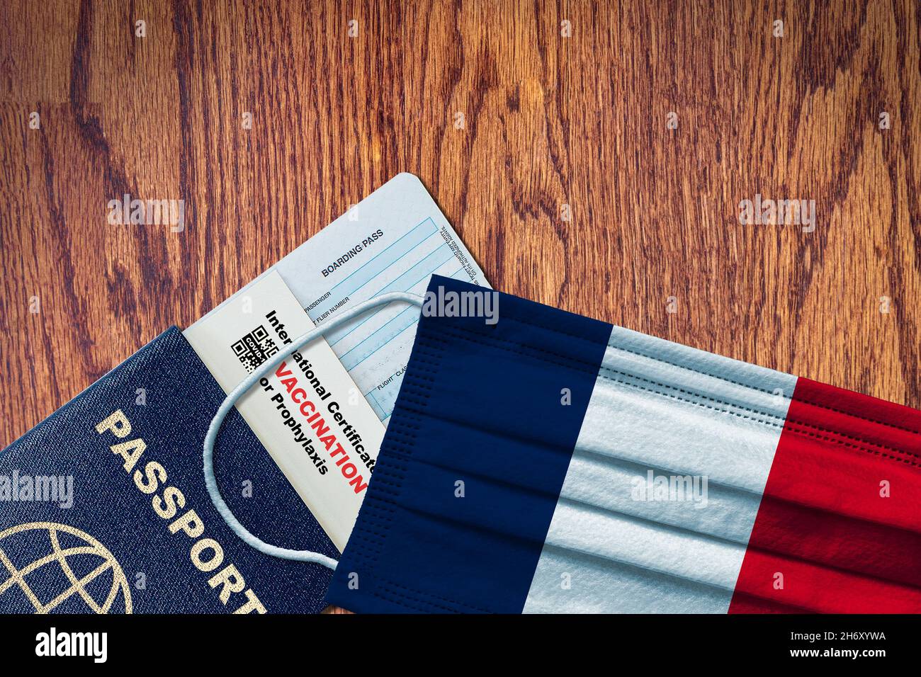 France new normal travel with passport, boarding pass, face mask with French flag and certificate of COVID-19 vaccination. Vaccine passport concept wi Stock Photo