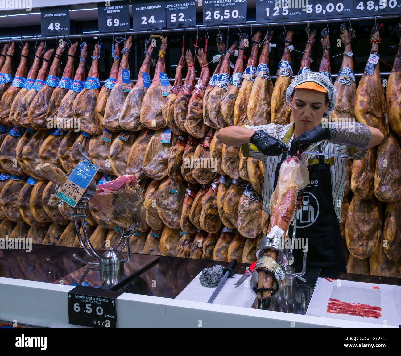 Hams hanging in supermarket hires stock photography and images Alamy