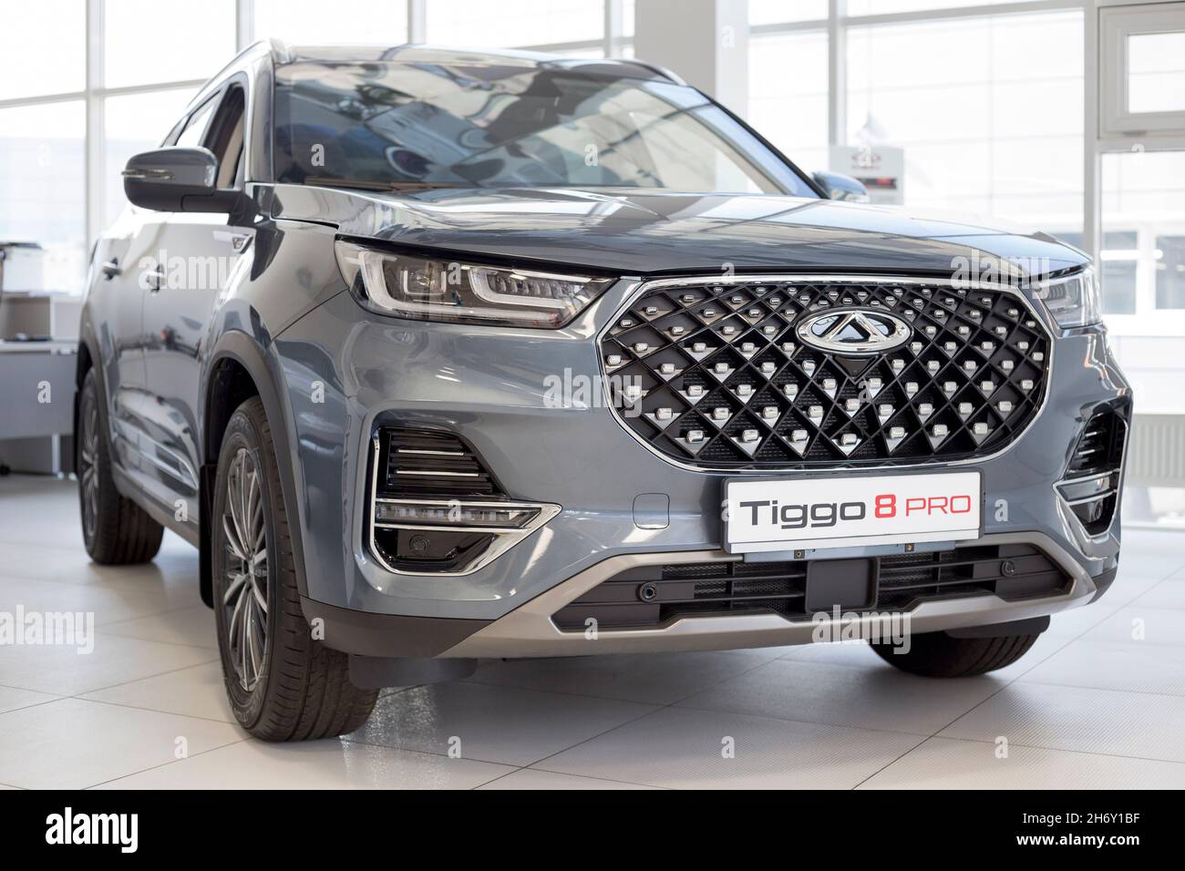 Russia, Izhevsk - August 19, 2021: Chery showroom. New modern Tiggo 8 Pro  car in dealer showroom. Front and side view. Car manufacturer from China  Stock Photo - Alamy