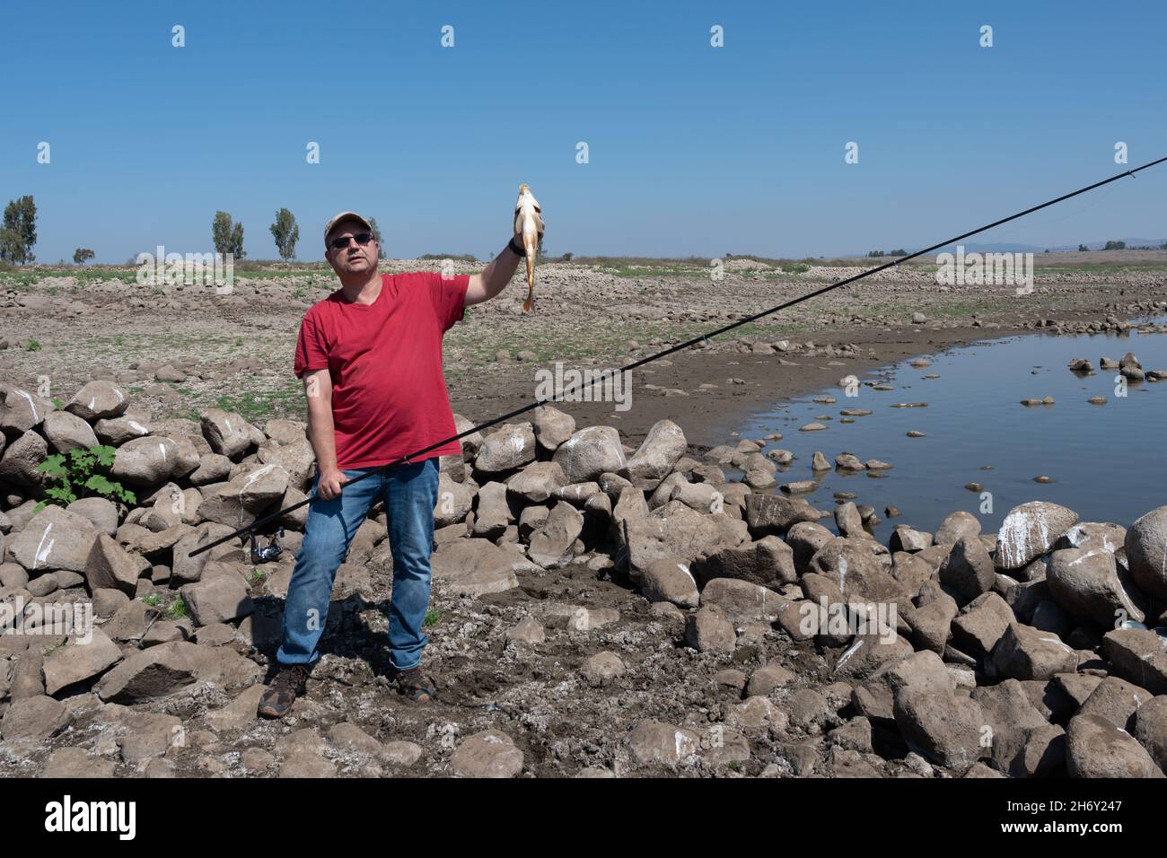Fisherman holds caught fish hi-res stock photography and images - Alamy