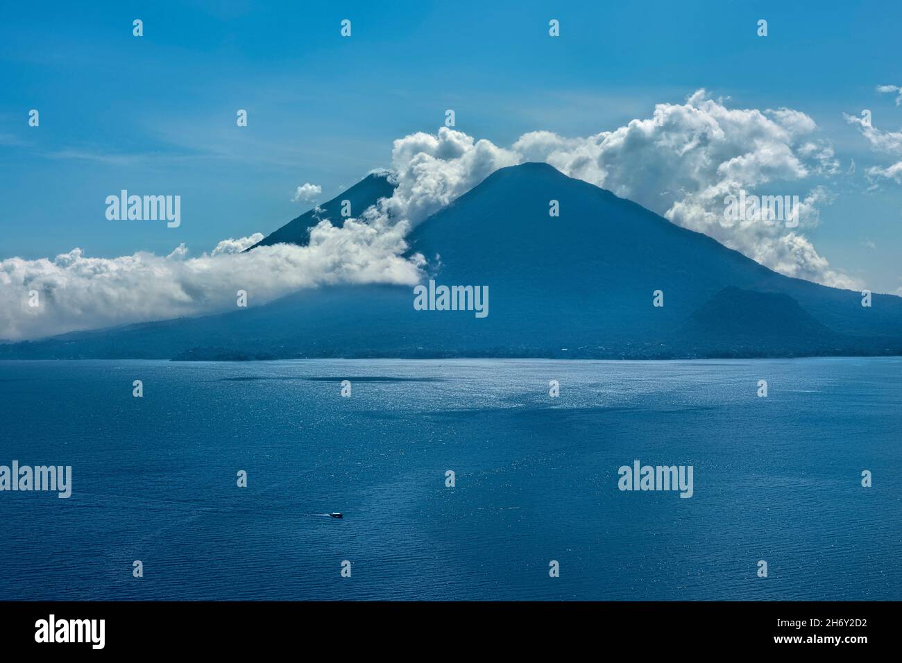 View of Santiago Atitlan and Toliman volcanoes from Santa Catarina Palopo, Lake Atitlan, Guatemala Stock Photo