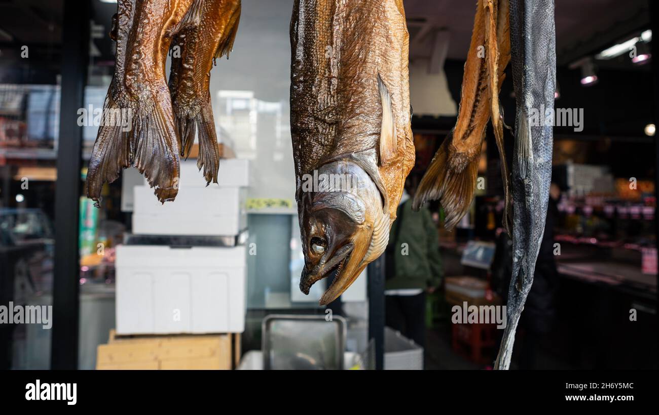 Merchants sale dry fish in famous Tsukiji fish market. Area around the biggest wholesale fish