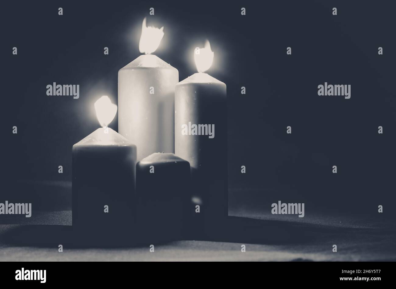 third burning advent candle monochrome concept Stock Photo - Alamy