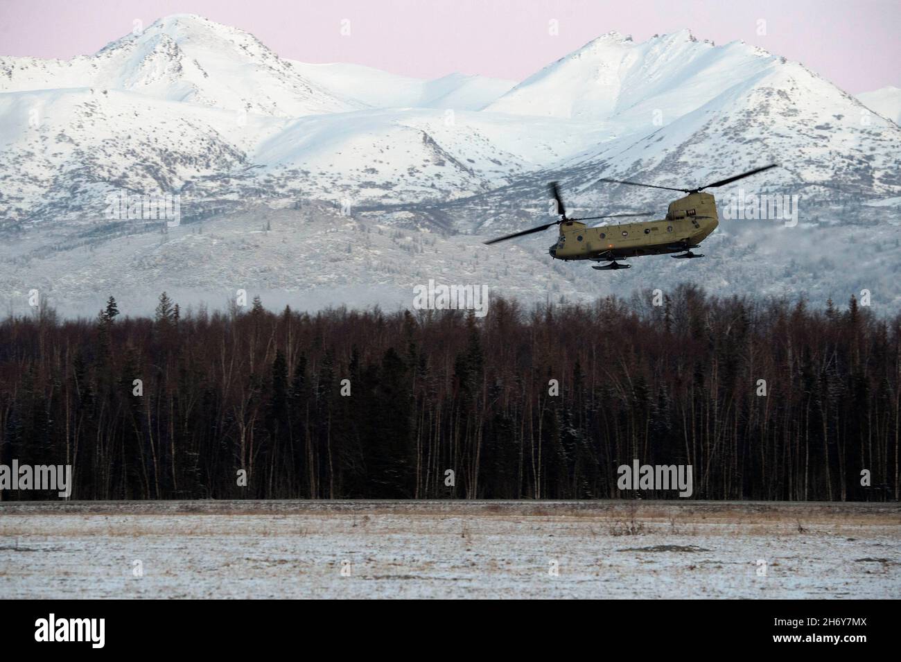 November 9, 2021 - Joint Base Elmendorf-Richardson, Alaska, USA - A U.S. Army CH-47F Chinook helicopter operated by air crew from the 1-52nd General Support Aviation Battalion, takes off from Malemute Drop Zone while supporting joint airborne training at Joint Base Elmendorf-Richardson, Alaska, Nov. 9, 2021. Army aviators and Air Force tactical air control party specialists from the 3rd Air Support Operations Squadron conducted the airborne training to maintain operational proficiency in an austere environment. Credit: U.S. Air Force/ZUMA Press Wire Service/ZUMAPRESS.com/Alamy Live News Stock Photo