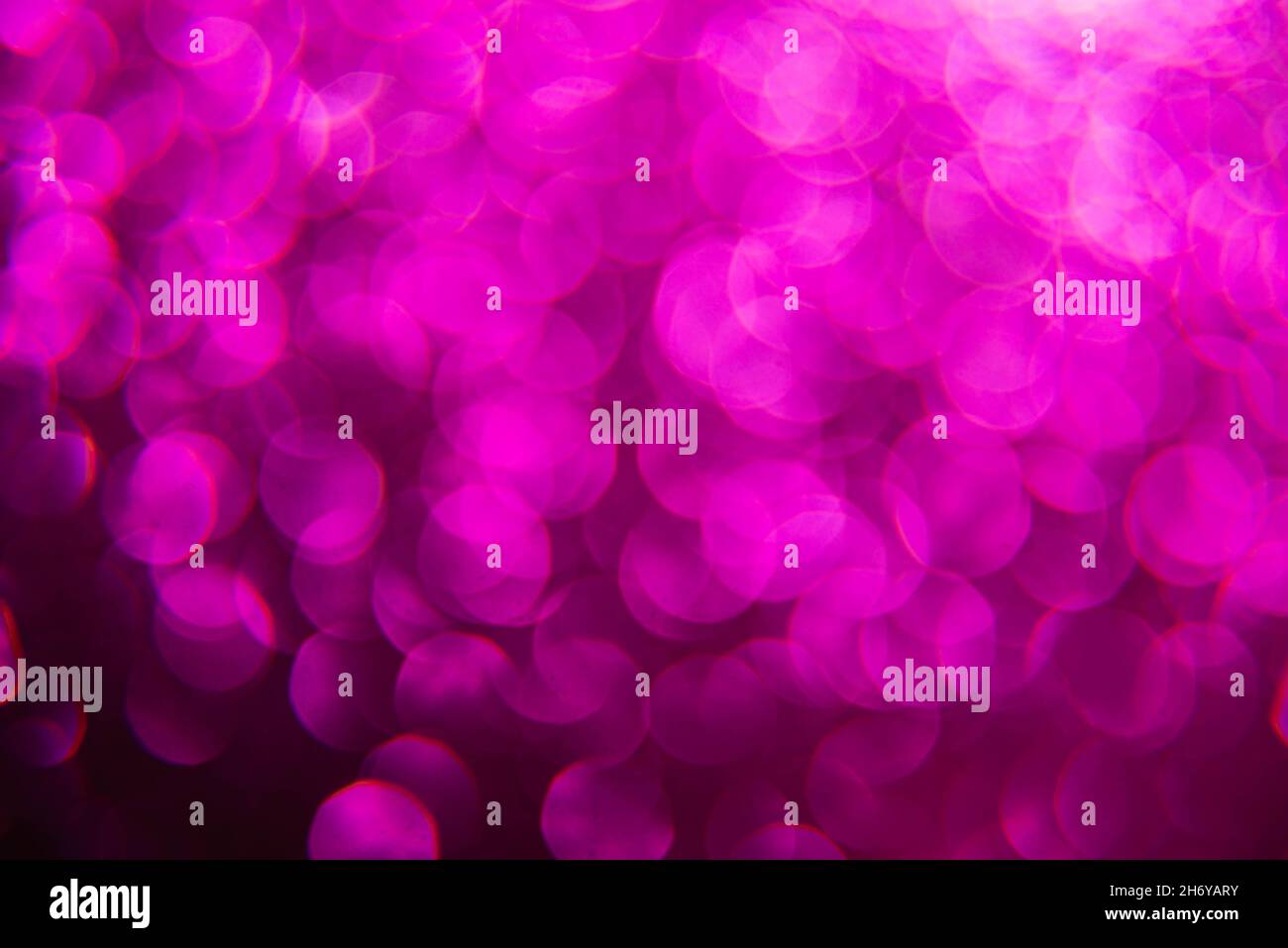 Texture created from oval purple objects. The effect was obtained by  photographing the glitter surface in a macro scale without focusing Stock  Photo - Alamy