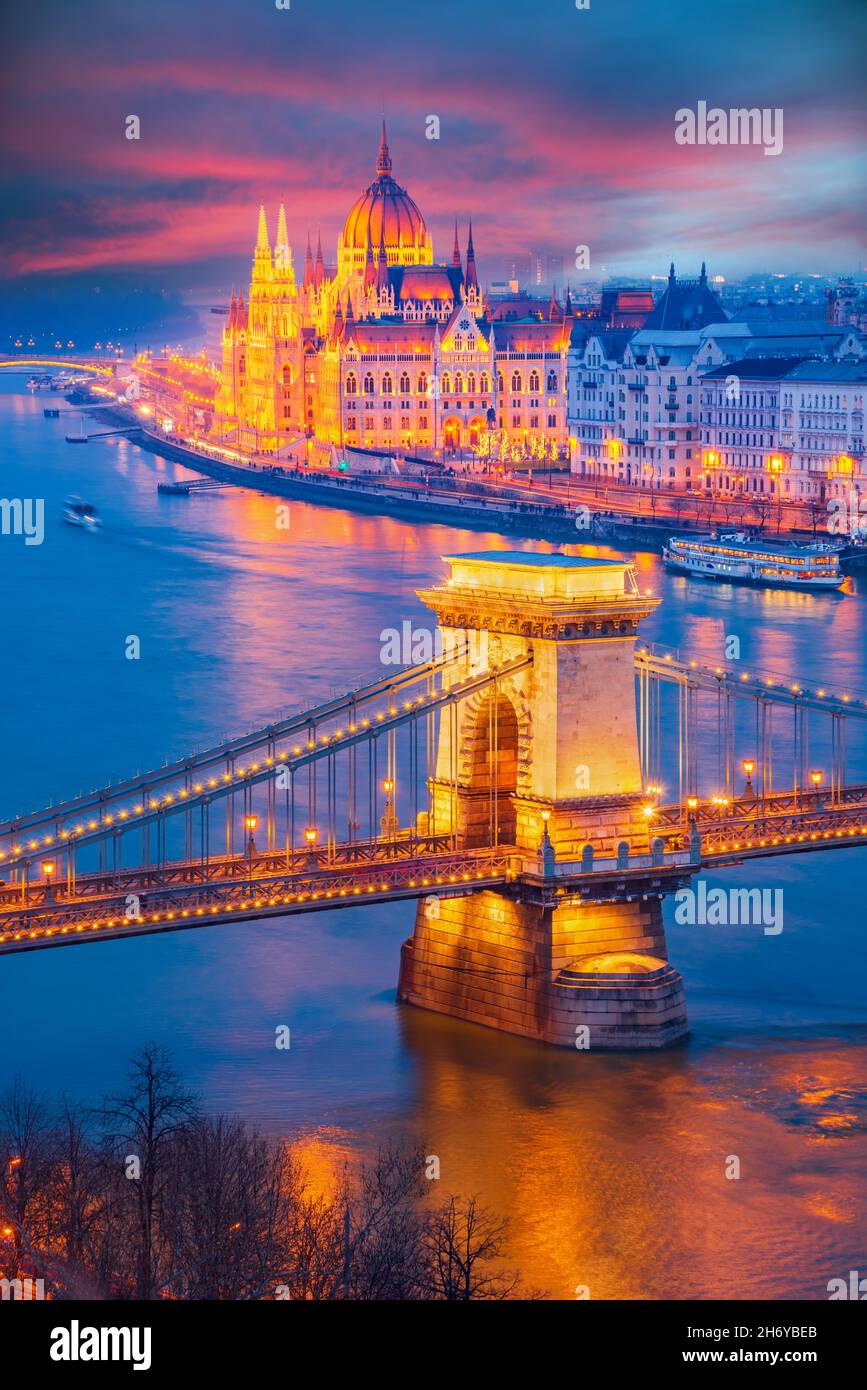 Budapest, Hungary. Colored sky night view on Chain Bridge and Parliament building over of Danube River. Stock Photo