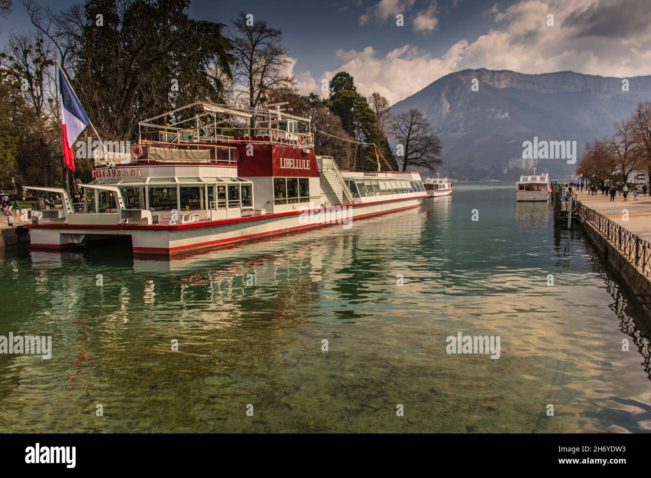 Libellule: anchored tourism boat in Annecy lake, France Stock Photo