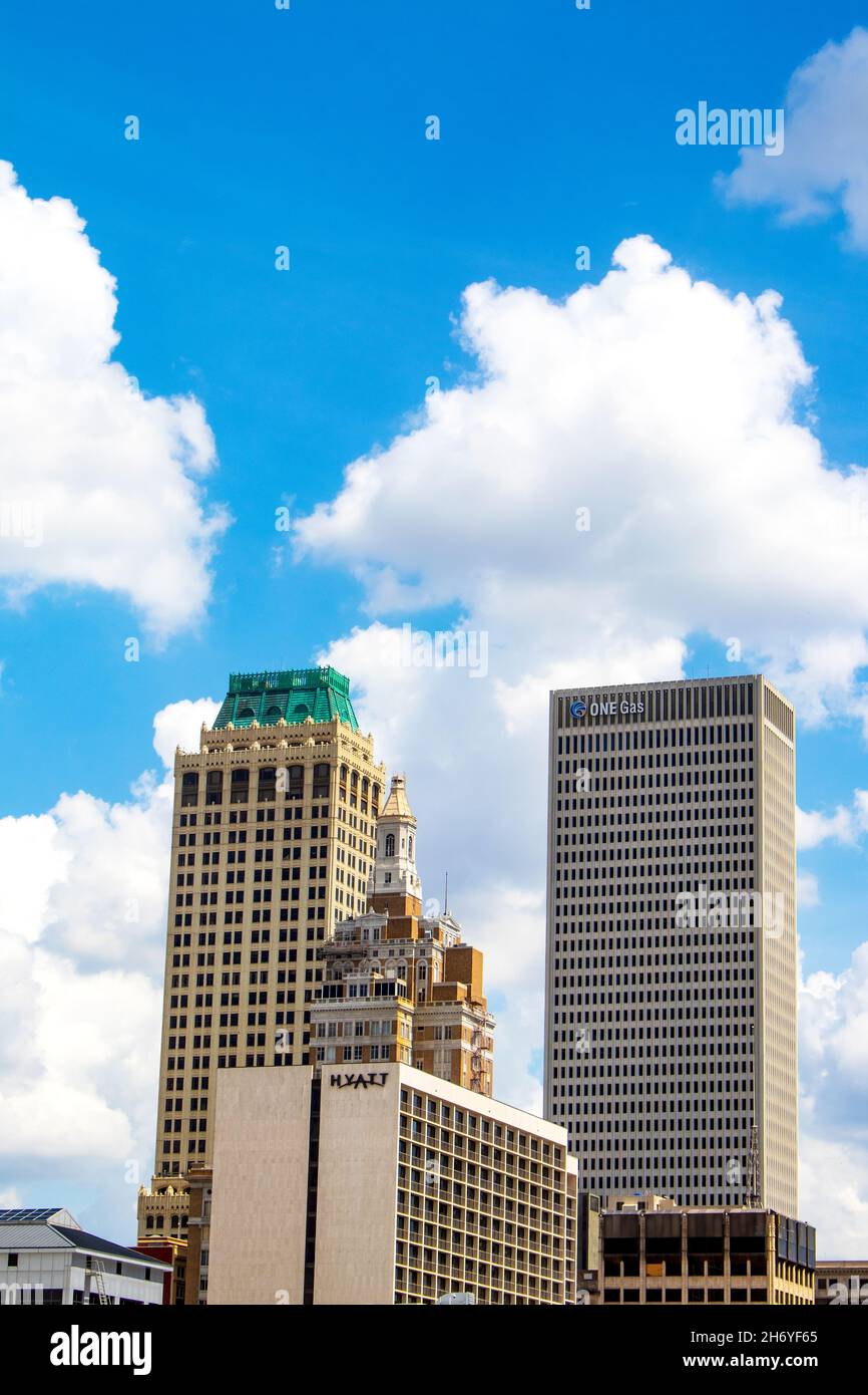 Tulsa Oklahoma USA 5 22 2018  City skyline with modern and art deco buildings in front of intense blue sky with fluffy white clouds Stock Photo