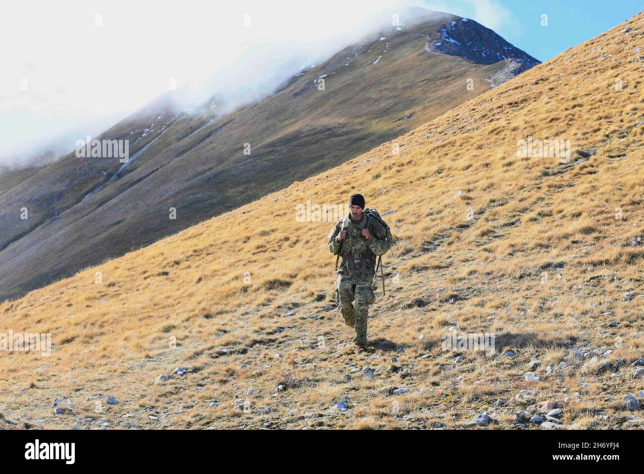 Camp Bondsteel, Kosovo. 2nd Nov, 2021. U.S. Army OR-5 Michael Dillon descends Mt. Ljuboten during the KFOR 29 Best Warrior Competition in Kosovo. U.S., Latvian, Polish, and Turkish Soldiers participated in a Best Mountain Warrior Competition on Camp Bondsteel and Mount Ljuboten, 1-3 November, 2021. The competition included a timed hike, a written test, a board, and stations testing various Soldier skills. Credit: U.S. Army/ZUMA Press Wire Service/ZUMAPRESS.com/Alamy Live News Stock Photo