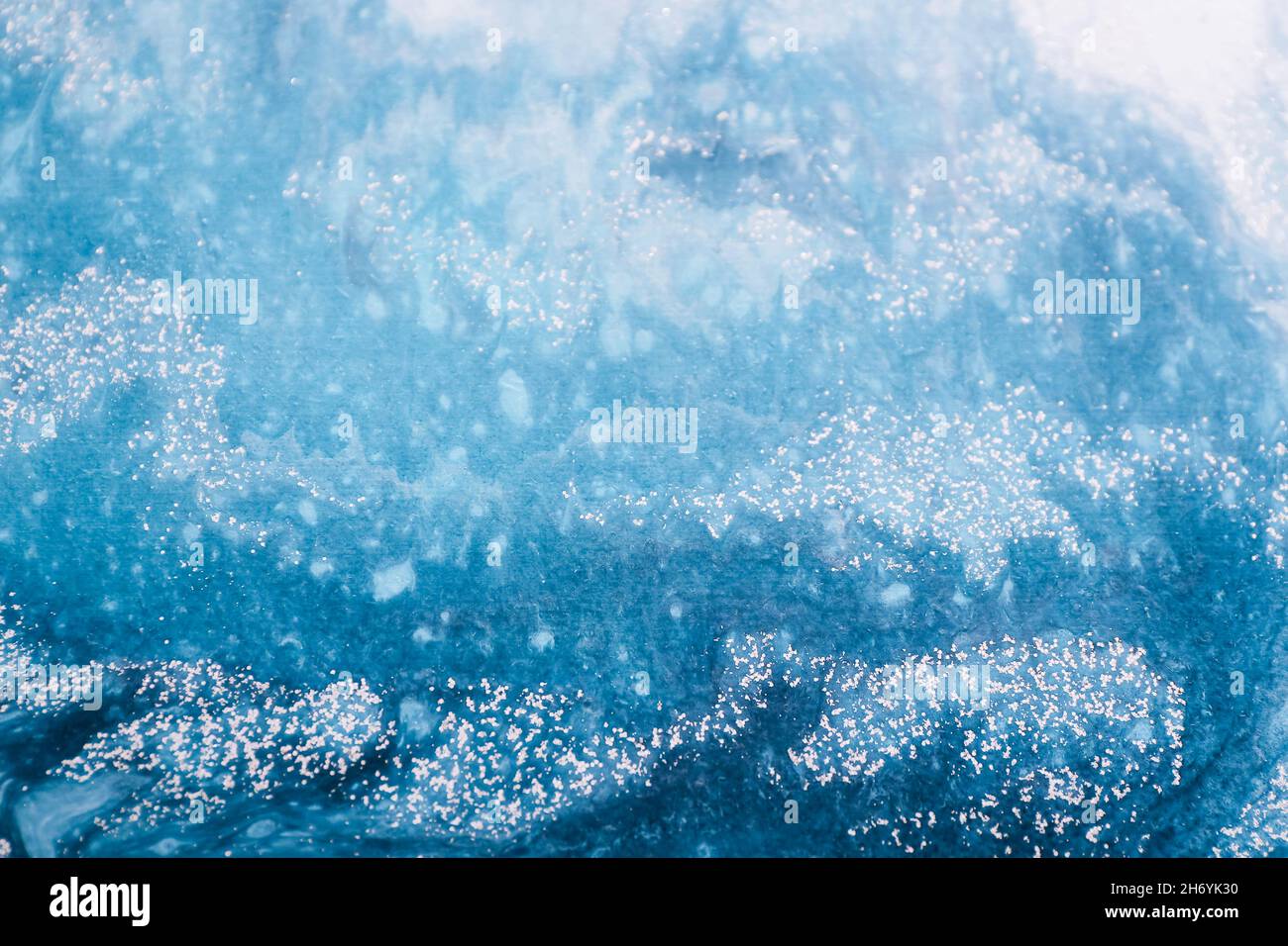 Abstract ocean waves painted on wooden canvas, close up Stock Photo