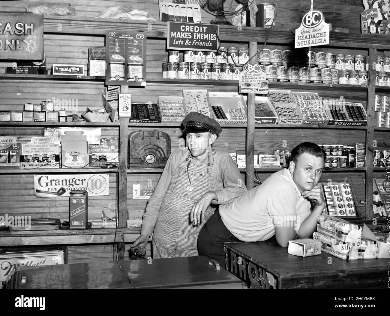 Mr. Coley and his Helper inside his General Store, Stem, North Carolina, USA, Jack Delano, U.S. Farm Security Administration, U.S. Office of War Information Photograph Collection Stock Photo