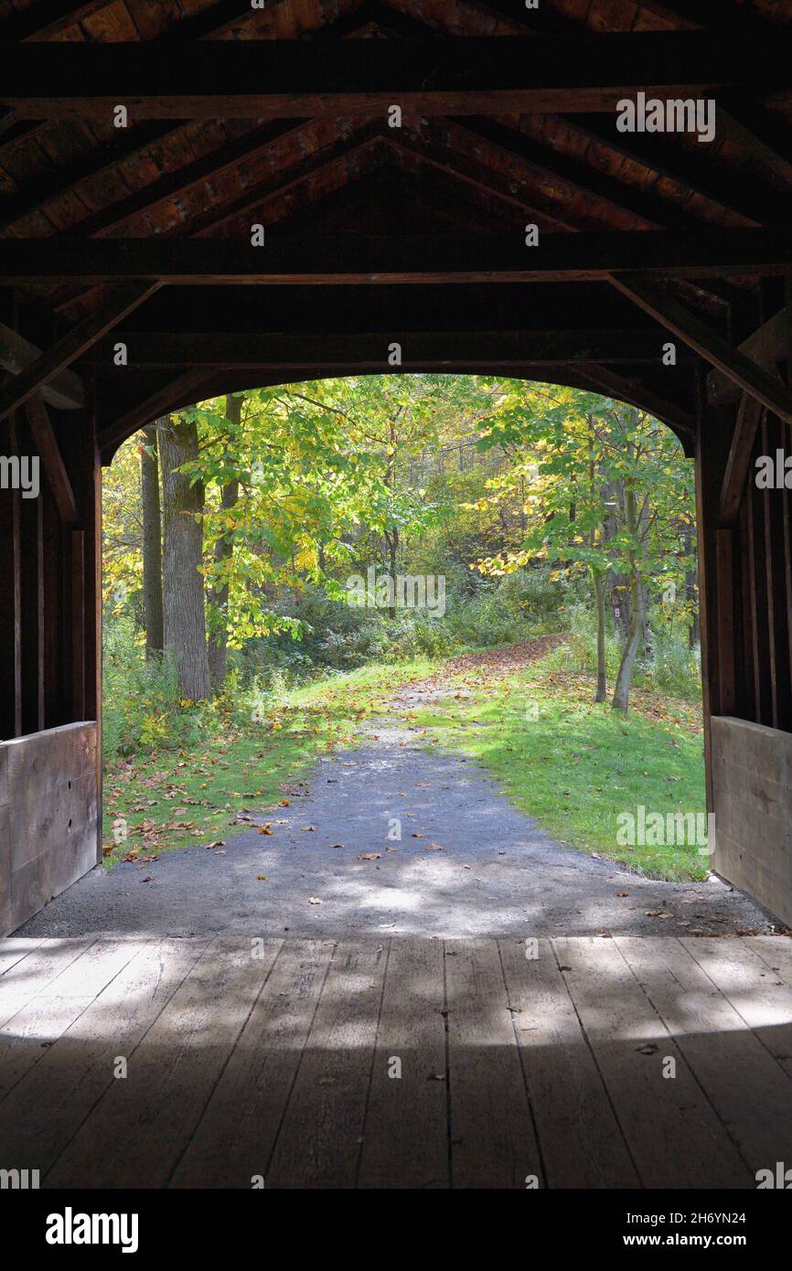 Cooperstown, New York, USA. A view from within the Hyde Hall Covered Bridge over Shadow Brook. The bridge was built in 1825. Stock Photo