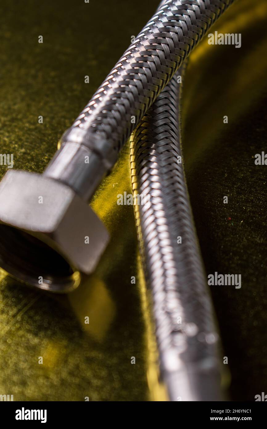 Macro of metal cable texture with a golden background Stock Photo