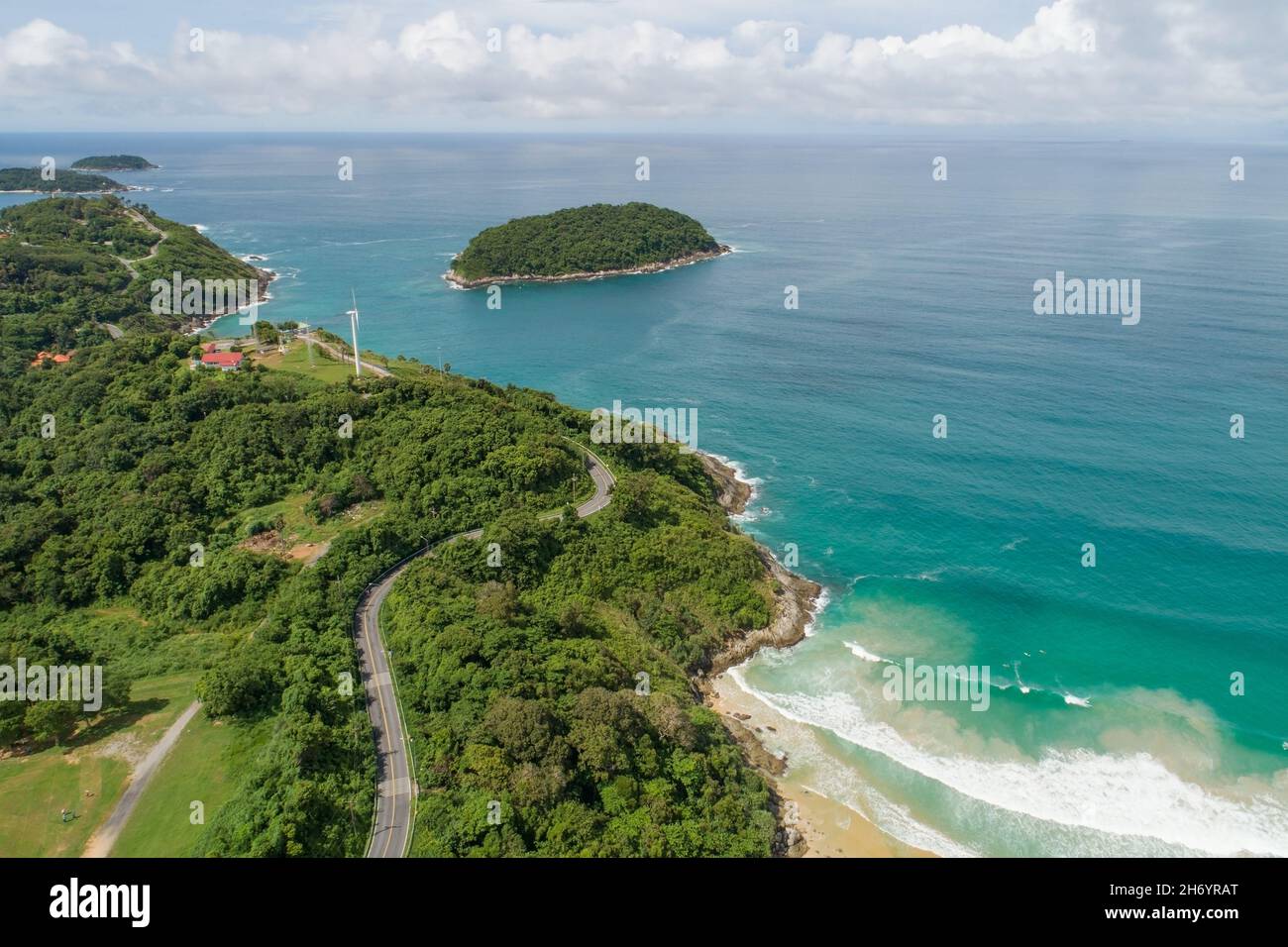 Aerial view of curve road along the Naiharn beach at Phuket Thailand beautiful sandy beach and open sea in summer season Nature recovered Environment Stock Photo