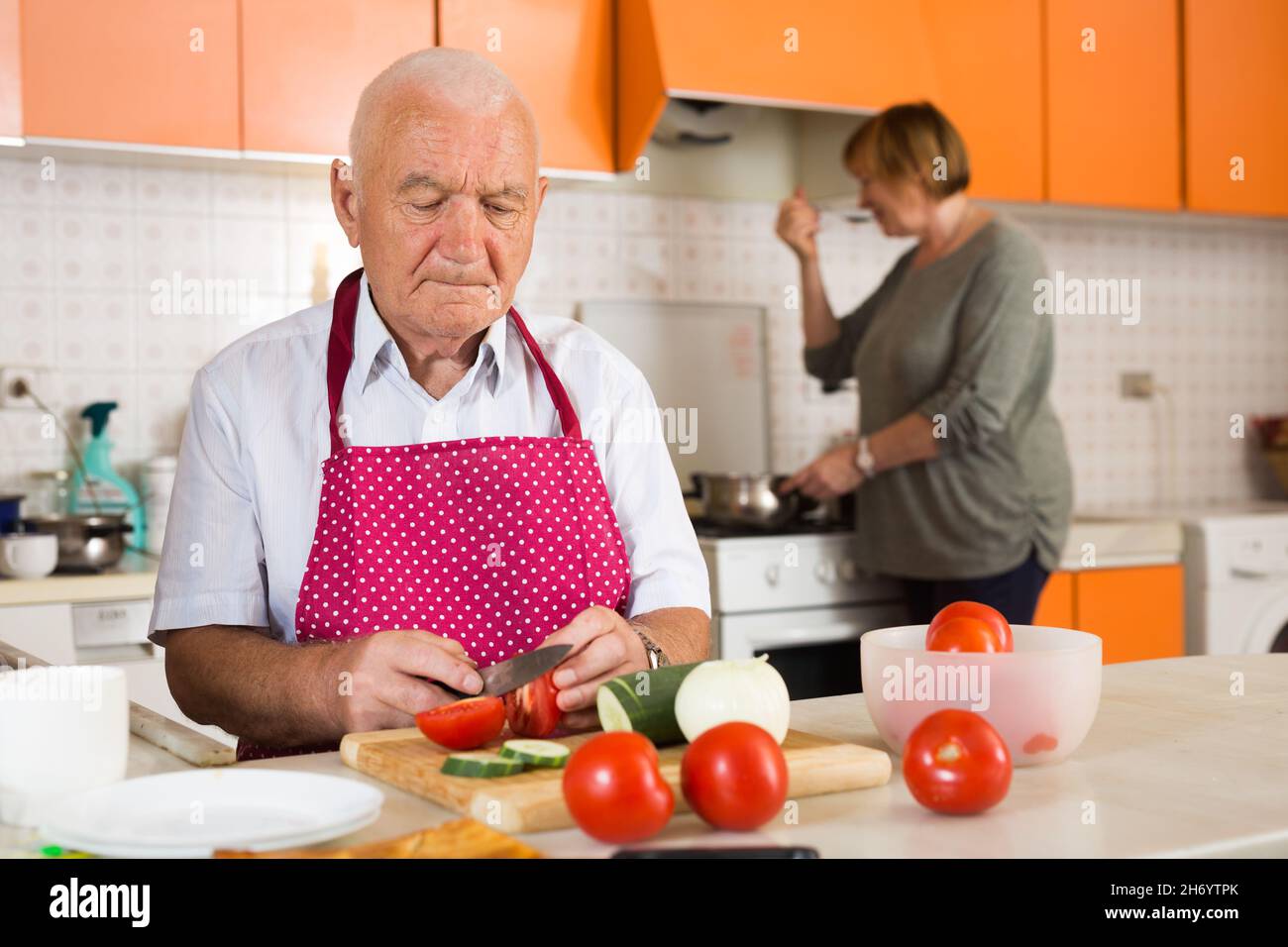 Senior couple cooking together Stock Photo