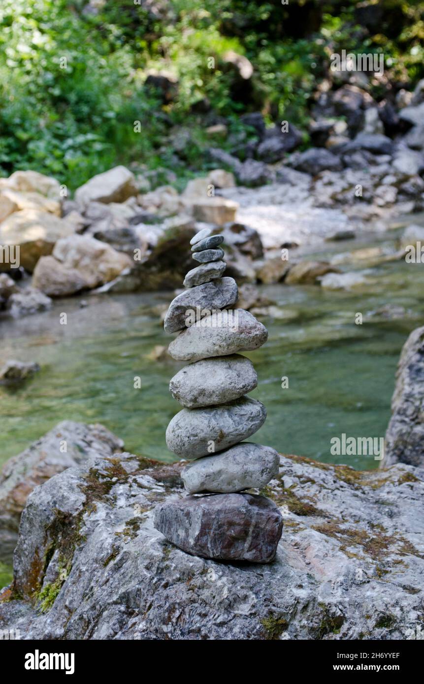 stone balance on rock in the river Stock Photo
