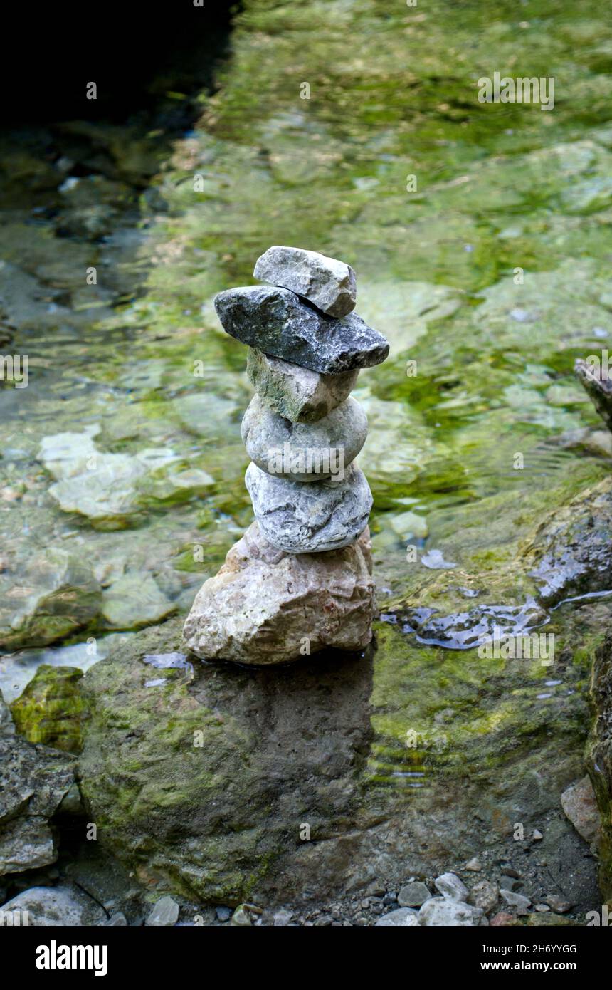 stone balance on rock in the river Stock Photo