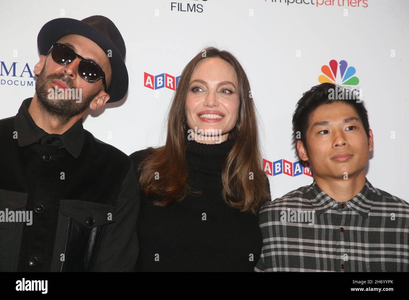 Los Angeles, Ca. 18th Nov, 2021. JR, Angelina Jolie and Pax Thien Jolie-Pitt at Paper & Glue/A JR Project LA Premiere Screening at Museum of Tolerance in Los Angeles, California on November 18, 201. Credit: Faye Sadou/Media Punch/Alamy Live News Stock Photo