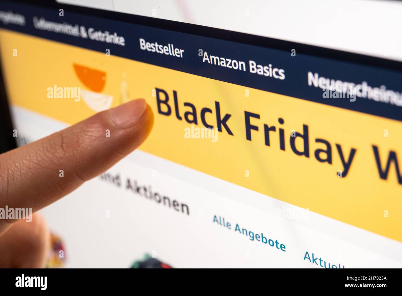 Oldenburg, Germany. 18th Nov, 2021. A person looks at the Black Friday deals on Amazon's online shopping site on his tablet computer. (to dpa 'Despite supply bottlenecks: Black Friday attracts bargain hunters') Credit: Mohssen Assanimoghaddam/dpa/Alamy Live News Stock Photo