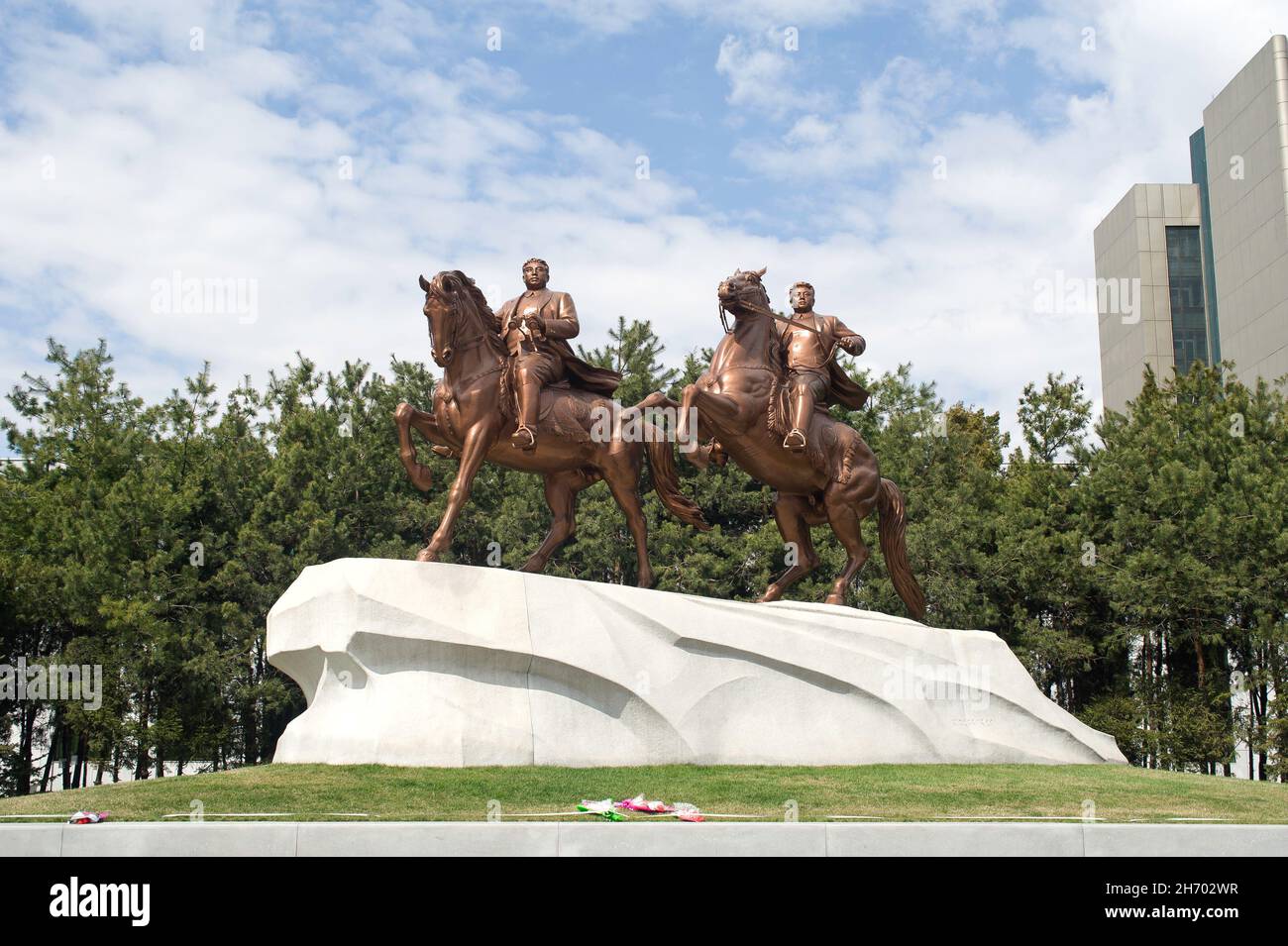Bronze statues of Kim Il-sung and Kim Jong-il riding horses outside Mansudae Art Studio in Pyongyang, North Korea. Stock Photo