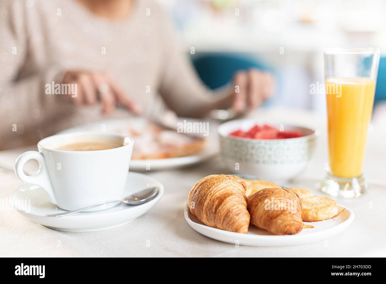 Coffee and croissant for breakfast in a table. Stock Photo