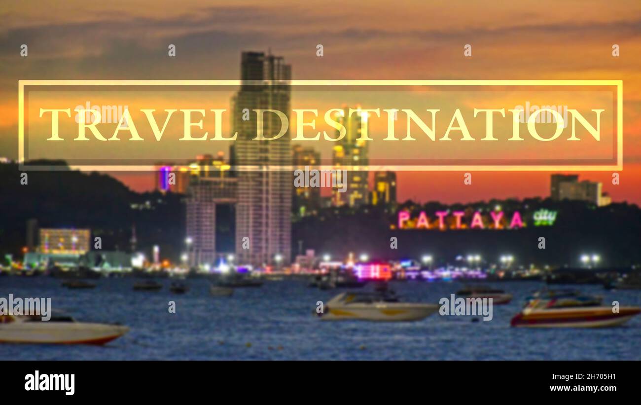 Travel destination background with blurred background of Pattya City, Chonburi, Thailand in the evening light with colourful city light. Stock Photo