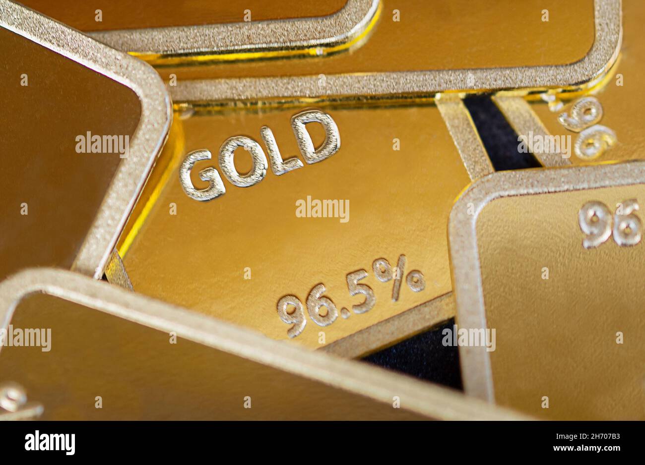 Gold bars background. Many gold ingots are close Stock Photo