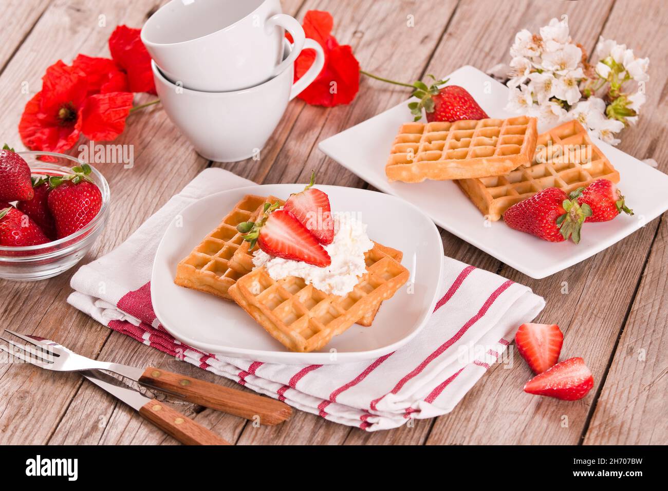 Waffles with strawberries and whipped cream Stock Photo - Alamy