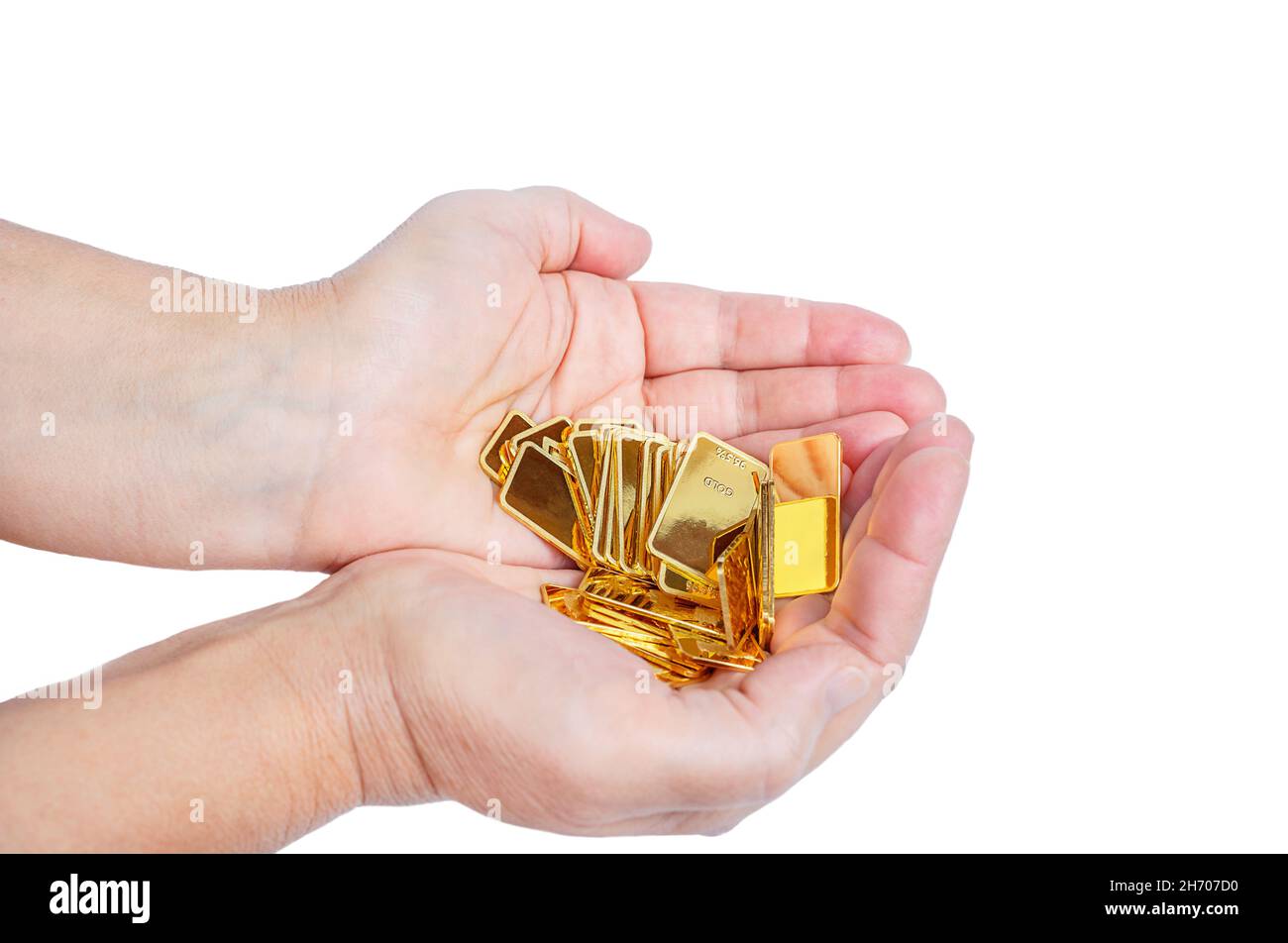 Gold bars are in female hands isolated on white background Stock Photo