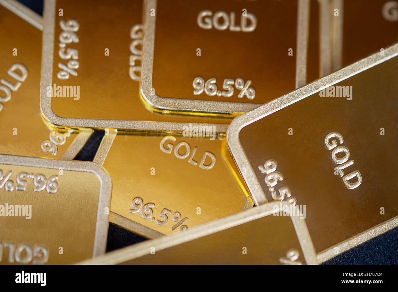 Gold bars background. Many gold ingots are close Stock Photo