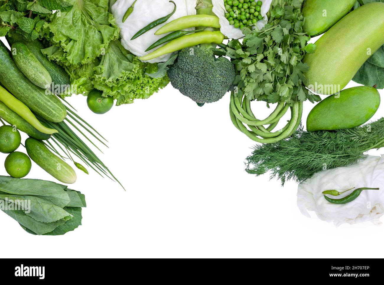 frame from green vegetables and fruits isolated on white background ...