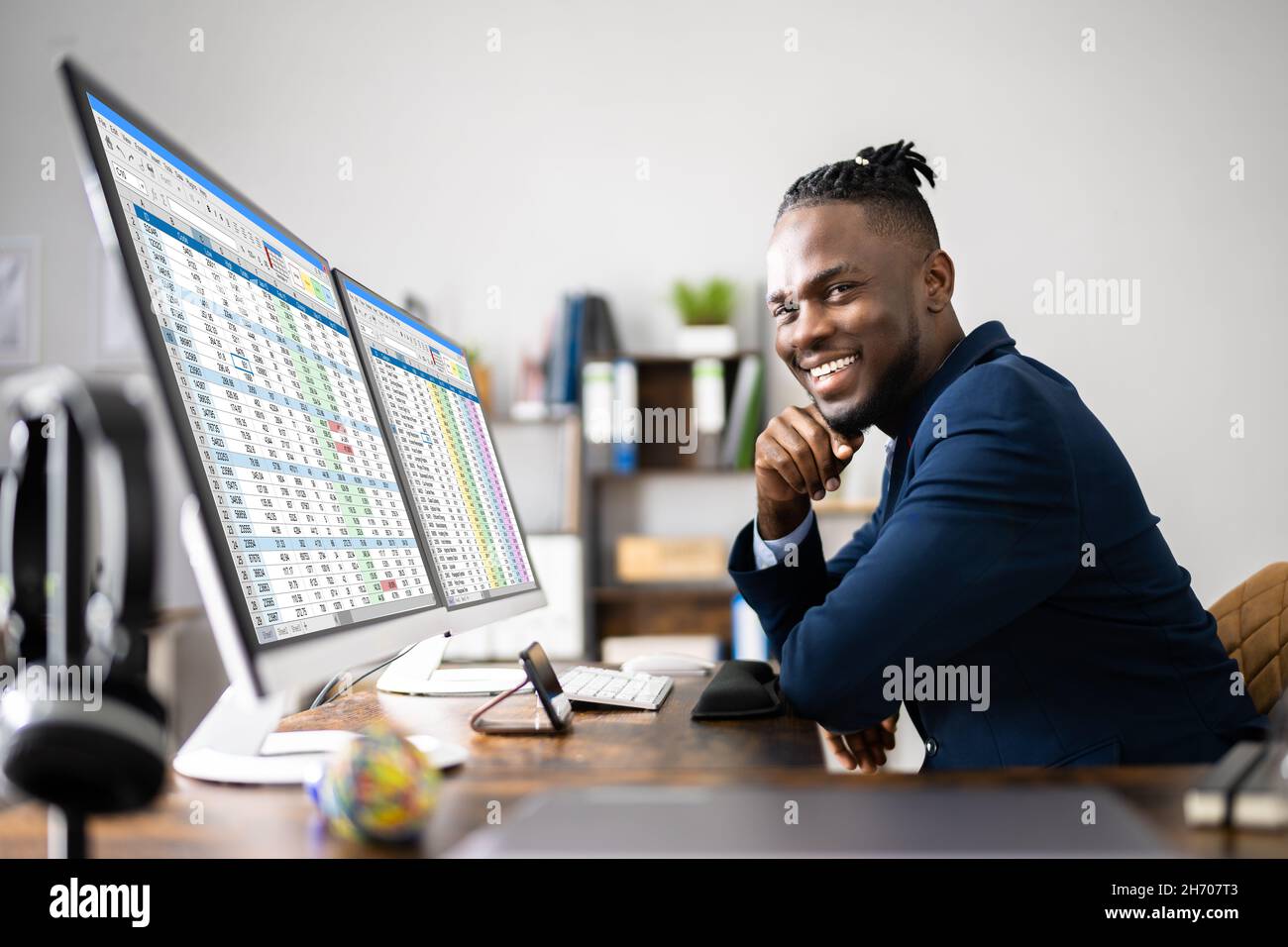 Analyst Employee Using Spreadsheet On Computer Screen Stock Photo