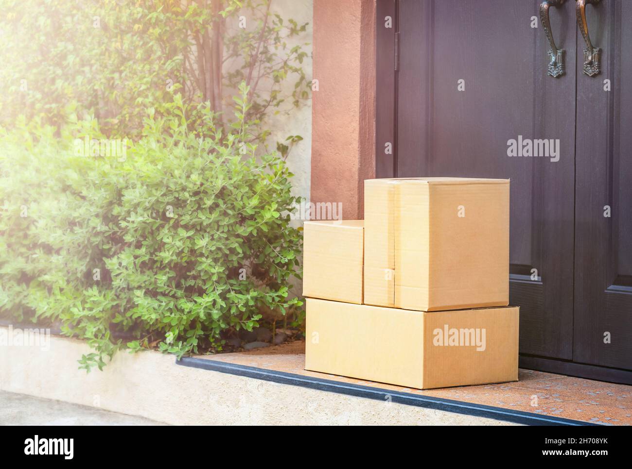 Cardboard boxes on the doorstep home delivery Stock Photo Alamy