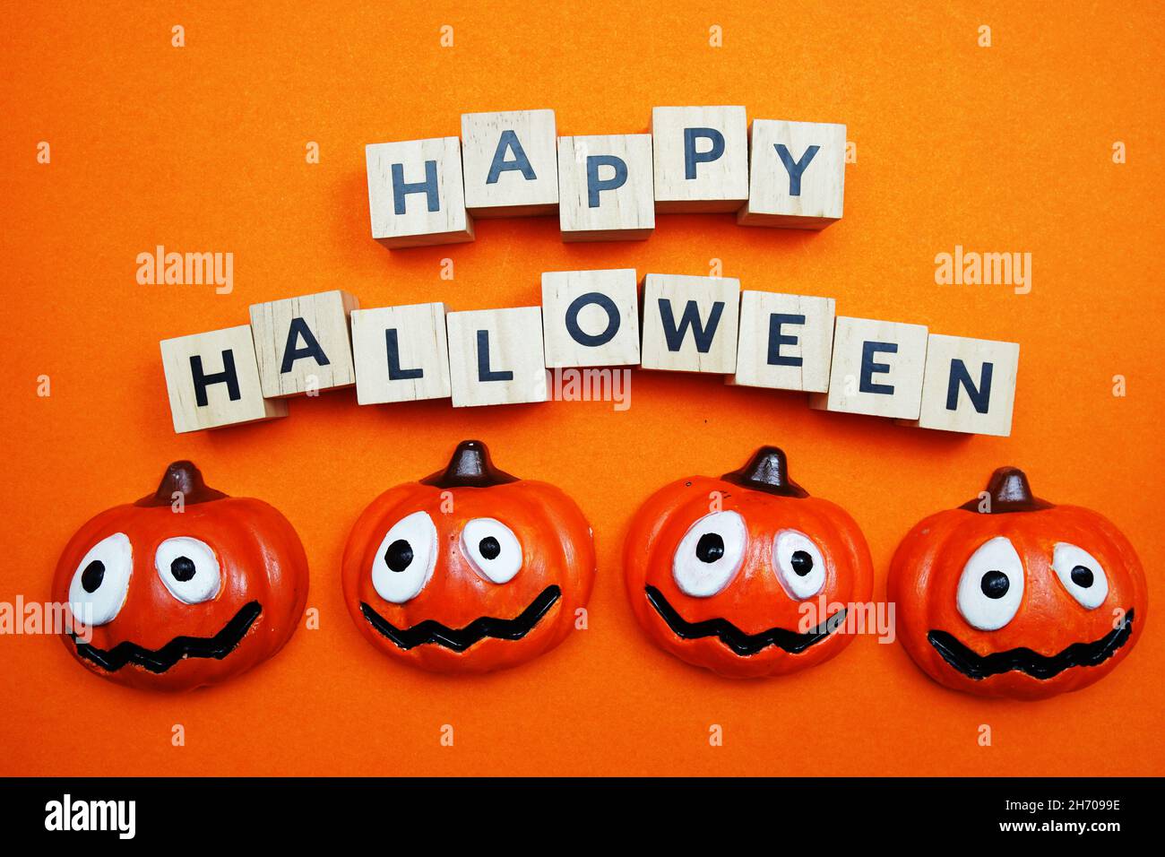 Happy Halloween alphabet letters top view on orange background Stock Photo