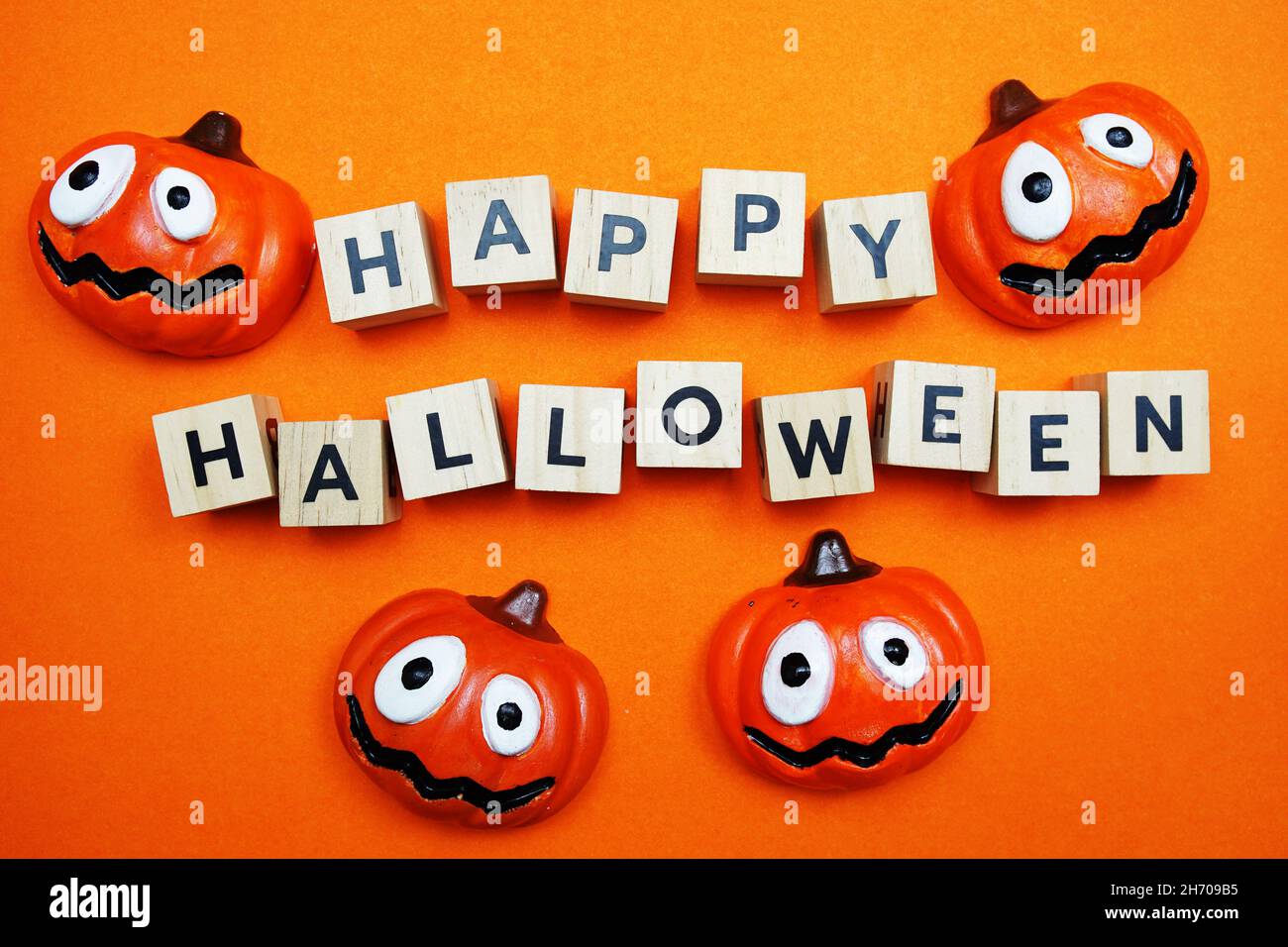 Happy Halloween alphabet letters top view on orange background Stock Photo