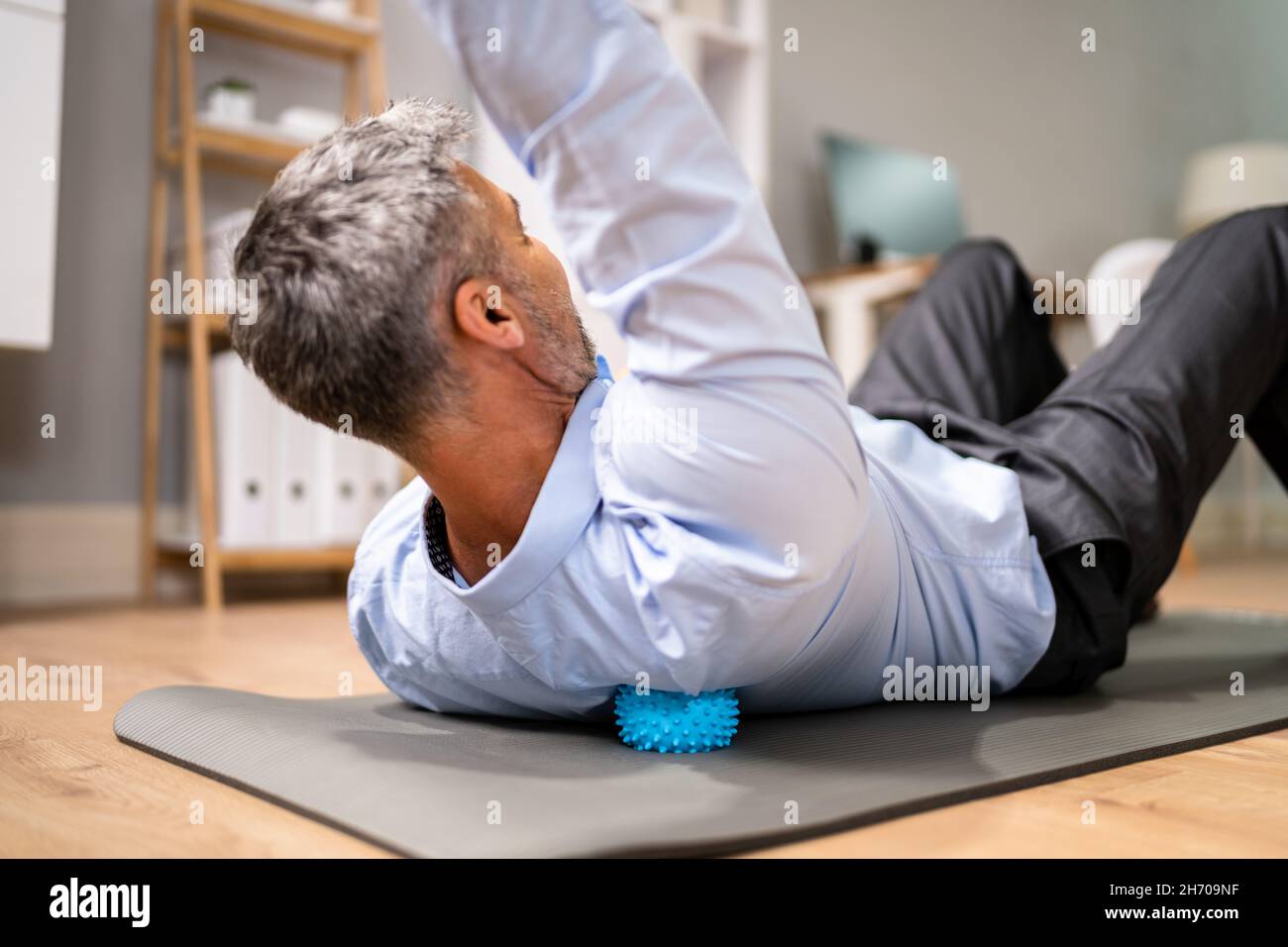 Back Trigger Point Massage Using Spiky Ball Myofascial Release Stock Photo Alamy